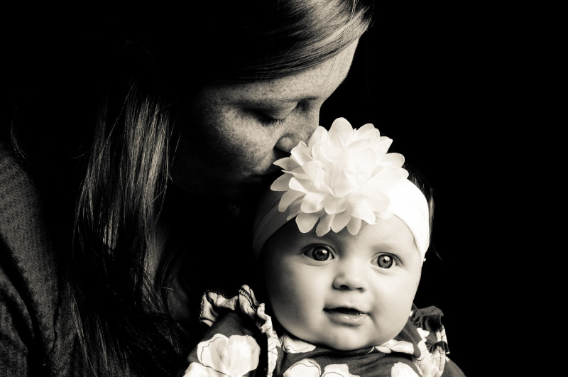 Portrait Winner January - A mother and her baby taking a portrait together embraced